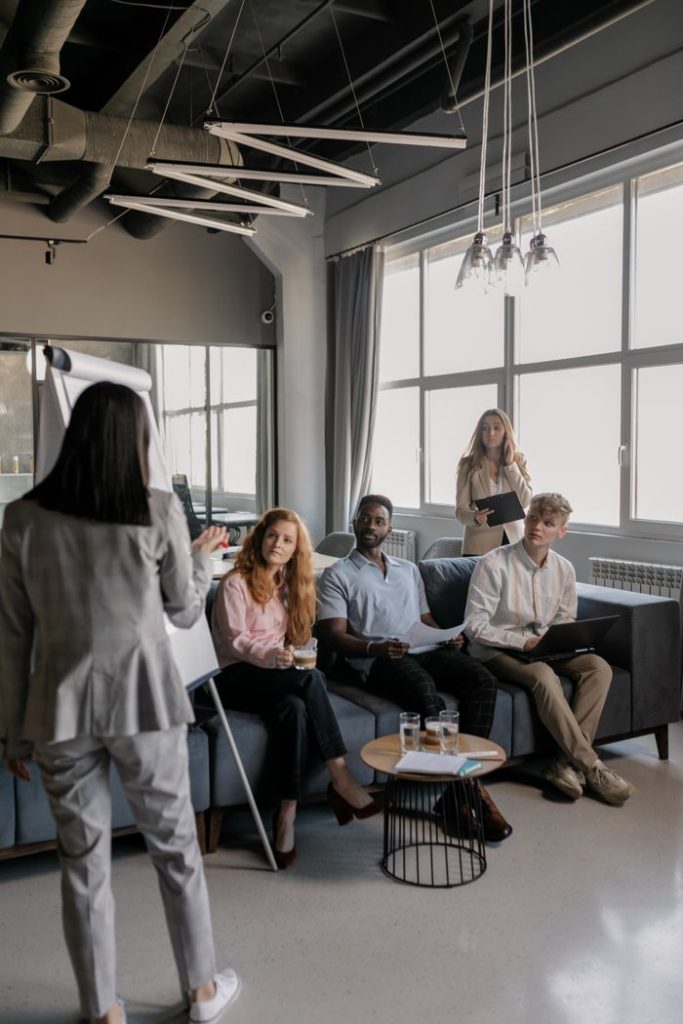 A team of professionals engaged in a business meeting in a modern office setting.